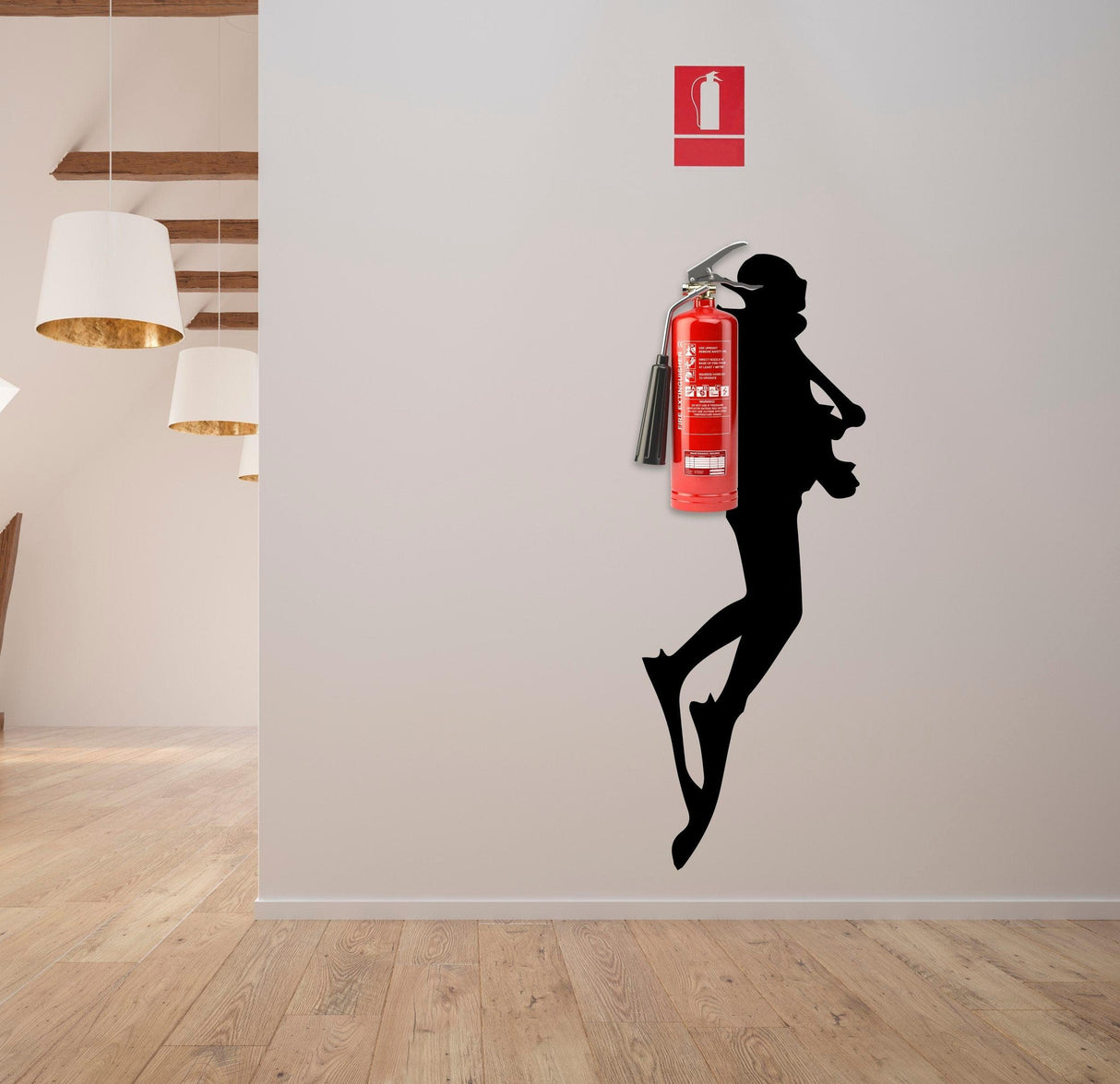 Scuba diver wall sticker silhouette next to a fire extinguisher in a modern interior setting.