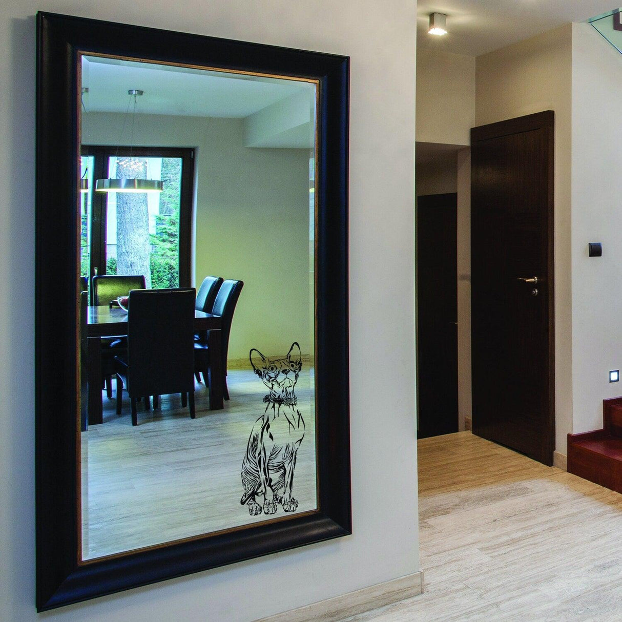 Custom wall decal of a cat on a mirror in a stylish home interior setting.