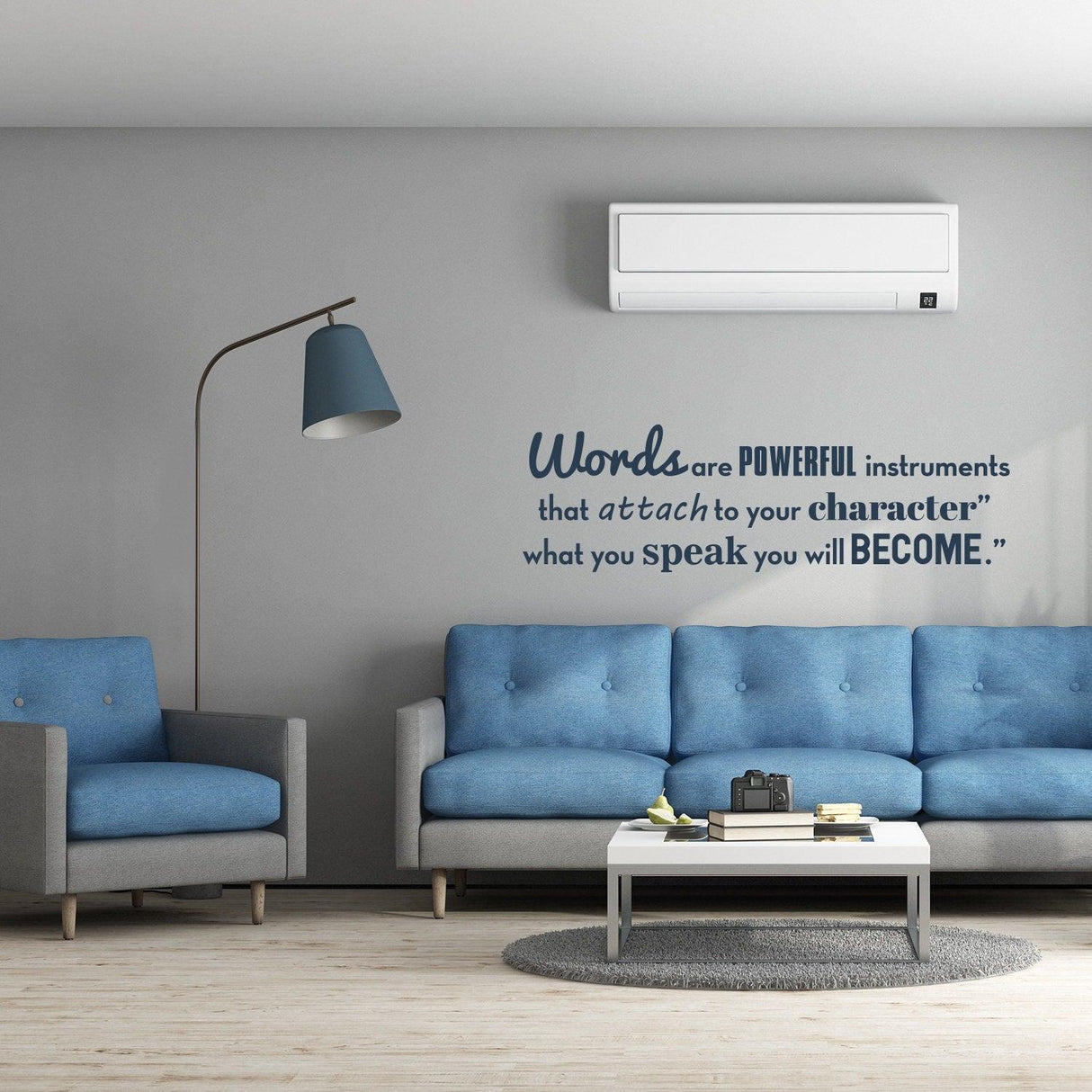 Inspirational wall vinyl quote sticker in modern living room with blue couch and stylish decor