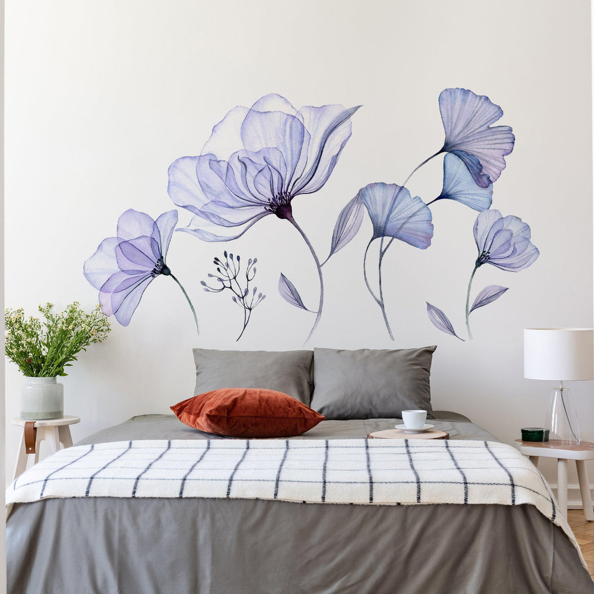 Floral wall sticker mural with blue flowers in a modern bedroom setting, adding vibrant decor to living space.