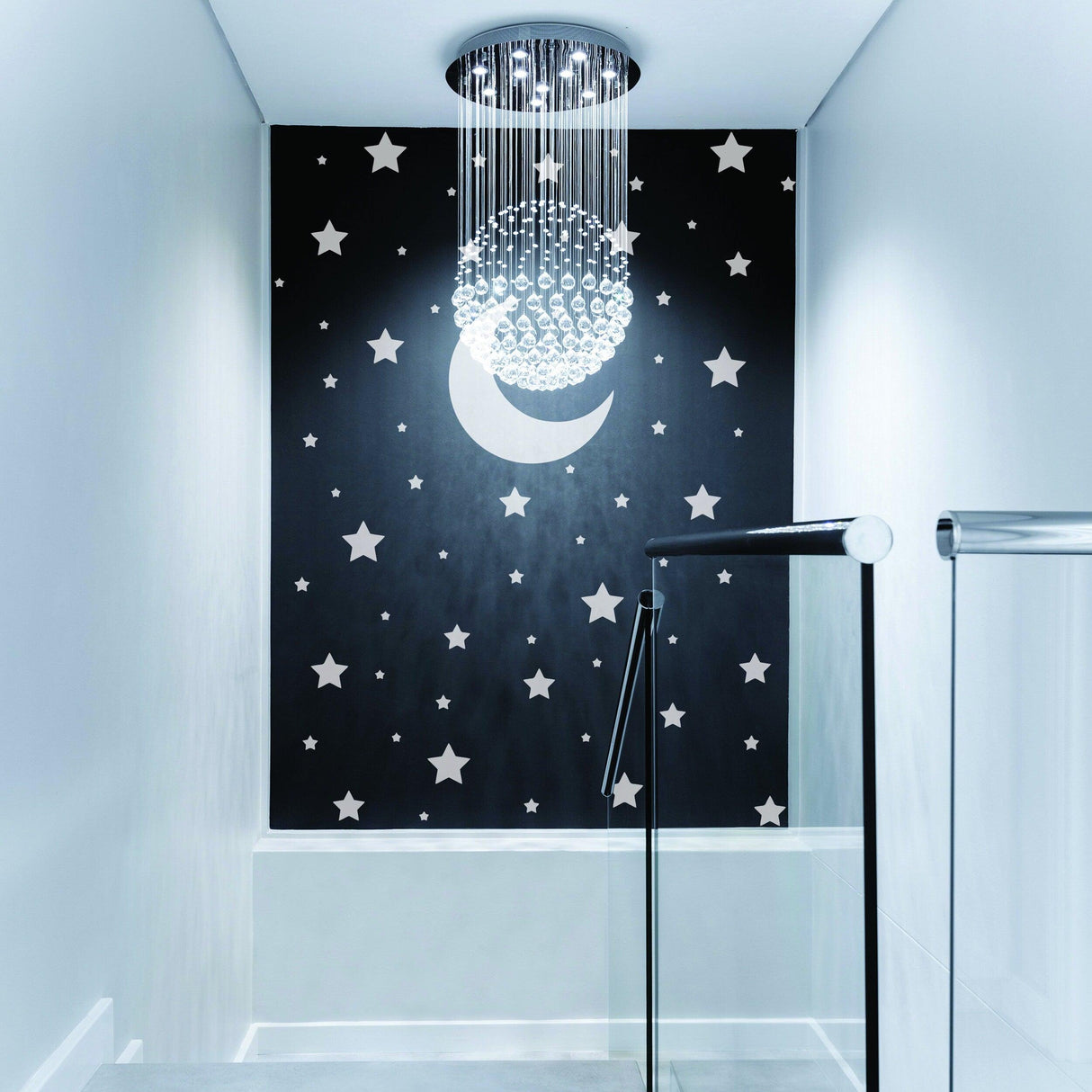 Moon and star wall decor in a modern hallway with stylish chandelier lighting.