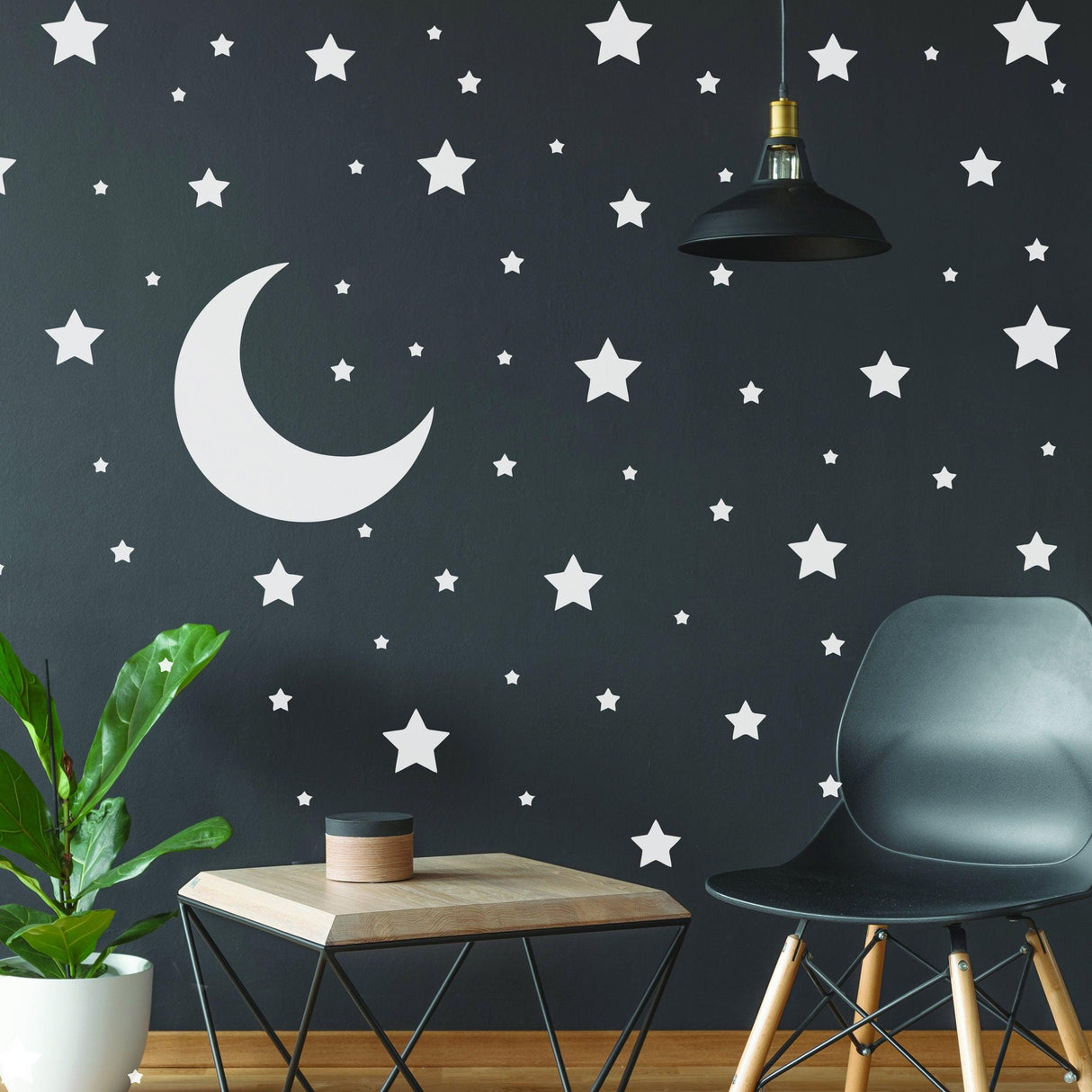 White stars and moon wall stickers on dark wall, perfect for nursery or kid's room decor.