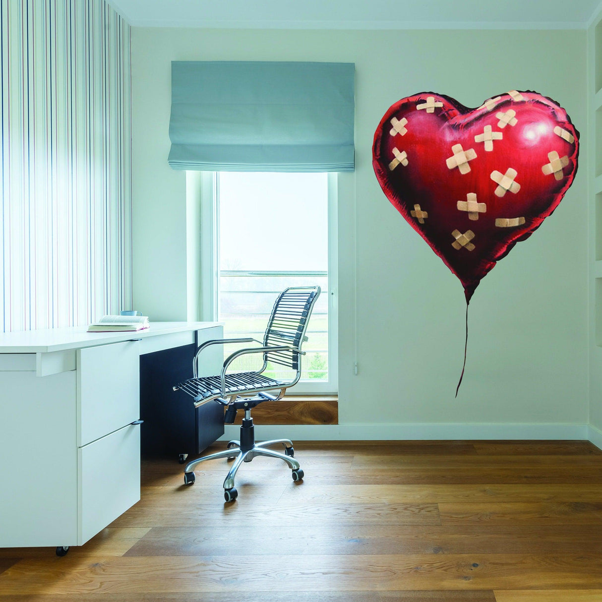 Banksy heart balloon vinyl wall sticker in modern office decor, adding a unique art touch to the room.