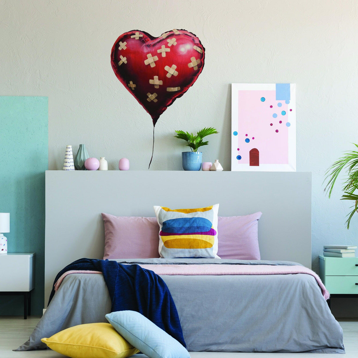 Banksy Heart Balloon Vinyl Wall Sticker in a stylish bedroom decor, adding unique art and charm to the space.