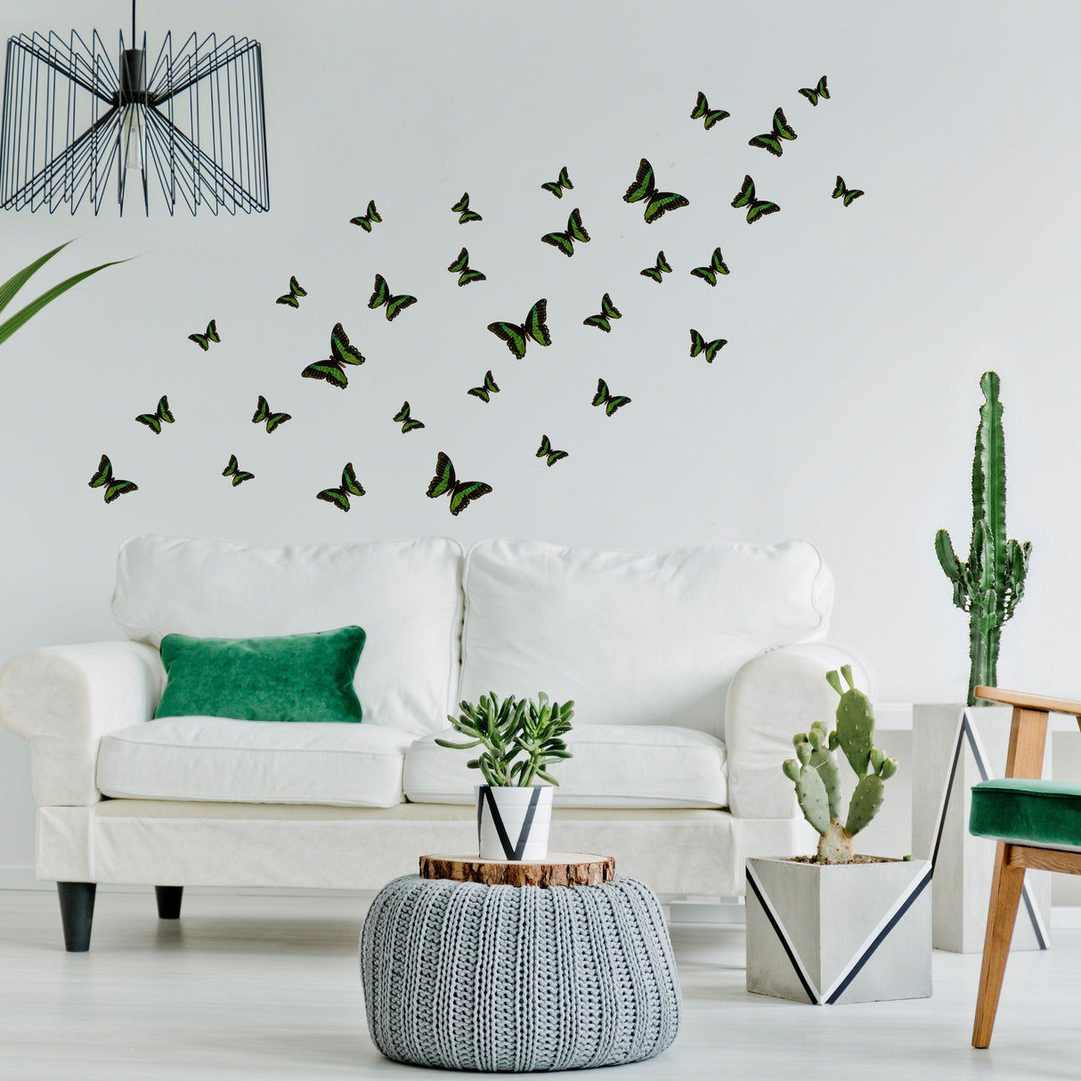 30 butterfly wall decor stickers enhancing a modern girl's bedroom with green and black accents.