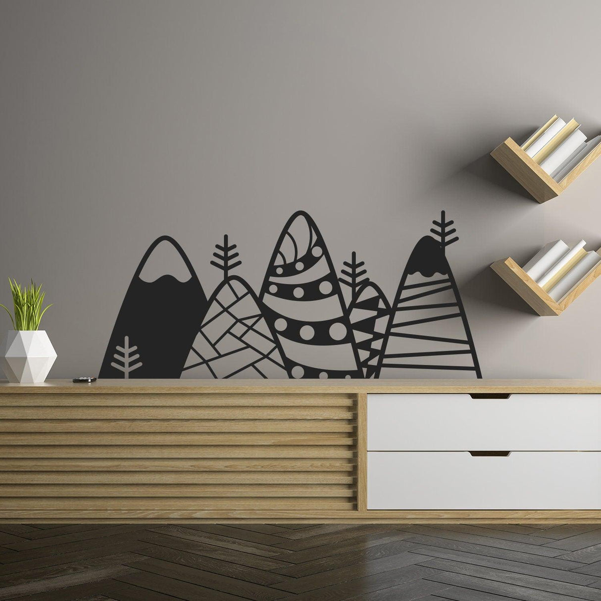 Patterned black mountain wall decor decal above wooden furniture in kid's room, modern vinyl art.