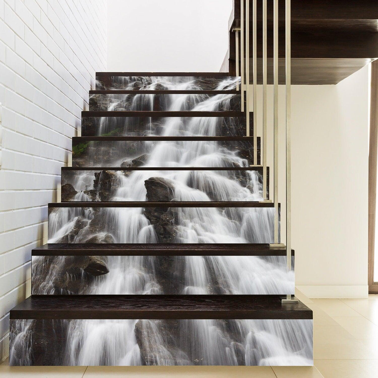 Stylish vinyl decals depicting a water cascade design on staircase risers, enhancing home decor.