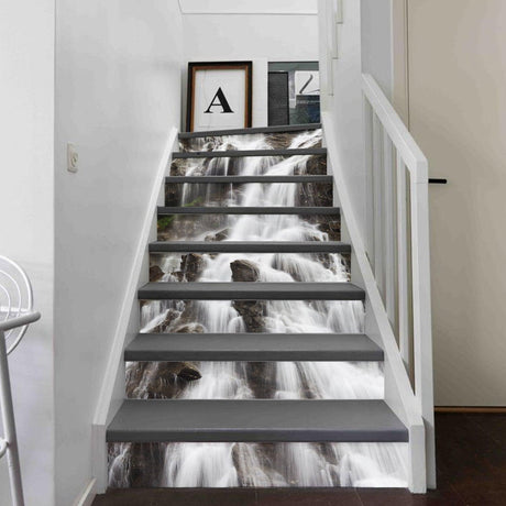 Stair riser vinyl decals featuring a waterfall design, enhancing the aesthetics of a modern staircase.