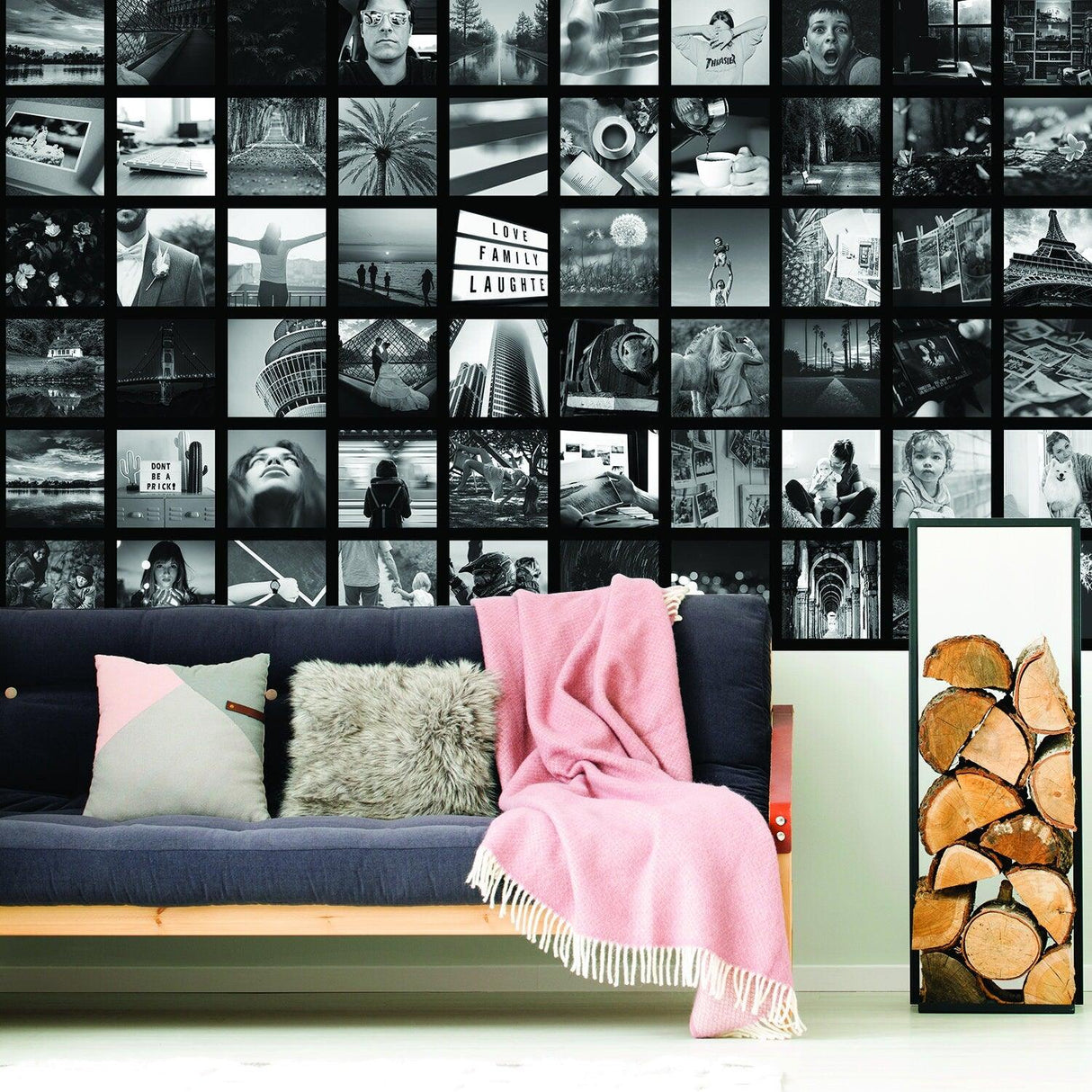 Stylish black and white photo collage wallpaper sticker above a cozy sofa with a pink blanket and cushion.