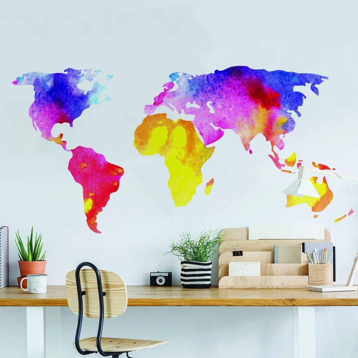 Colorful world map wall decal in a playroom, featuring vibrant continents and oceans, perfect for decoration.
