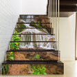 Stair riser vinyl decals featuring a beautiful waterfall design on a modern staircase.