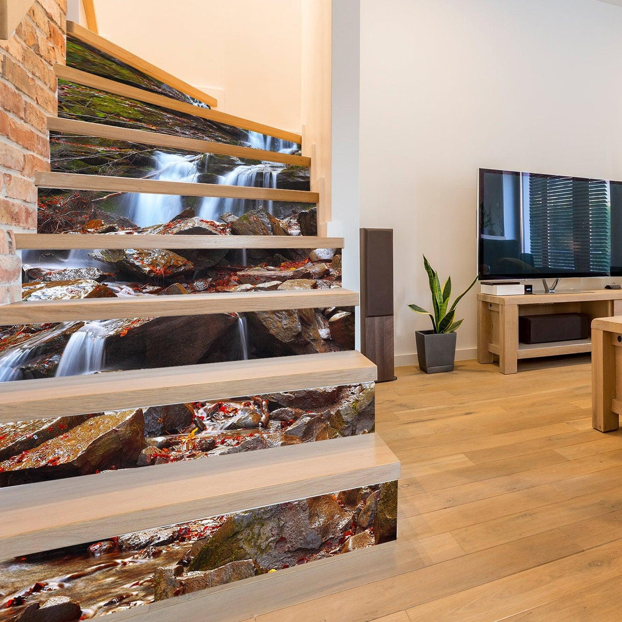 Stair riser vinyl decals featuring a water and rock theme, enhancing a modern staircase in a stylish living room.