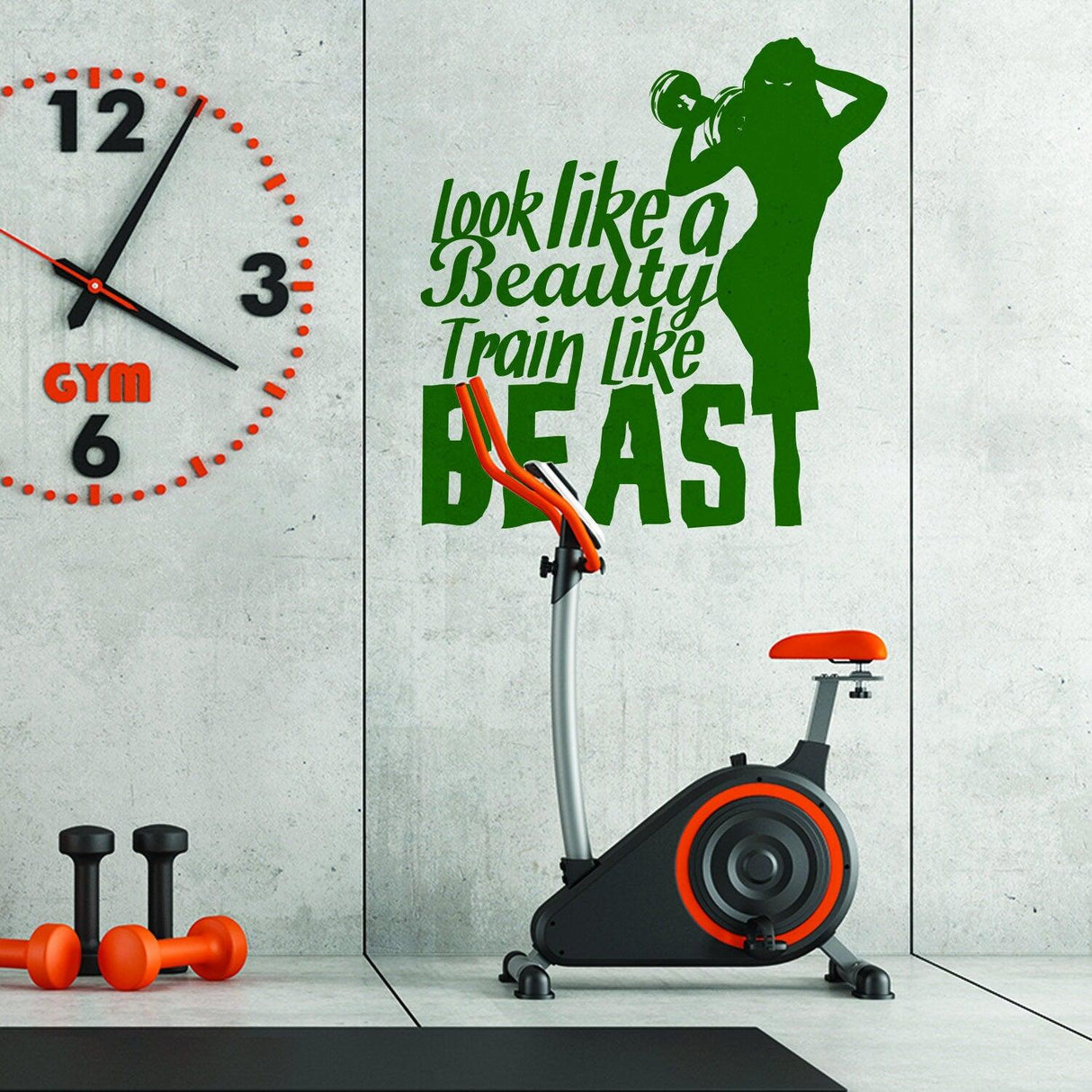 Vinyl decal saying 'Look like a beauty, train like a beast' on gym wall near exercise bike and clock.