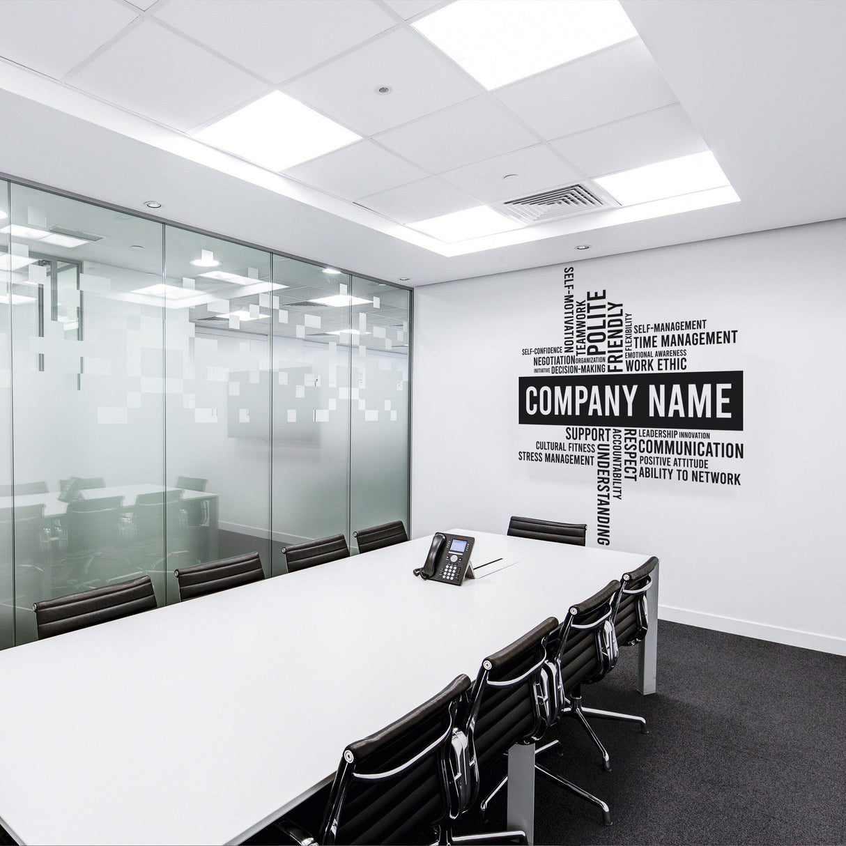 Custom Business Name Vinyl Wall Sticker in modern office meeting room with sleek decor and glass walls.
