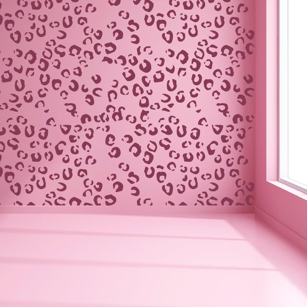 Leopard print vinyl wallpaper in a stylish pink room with natural light.