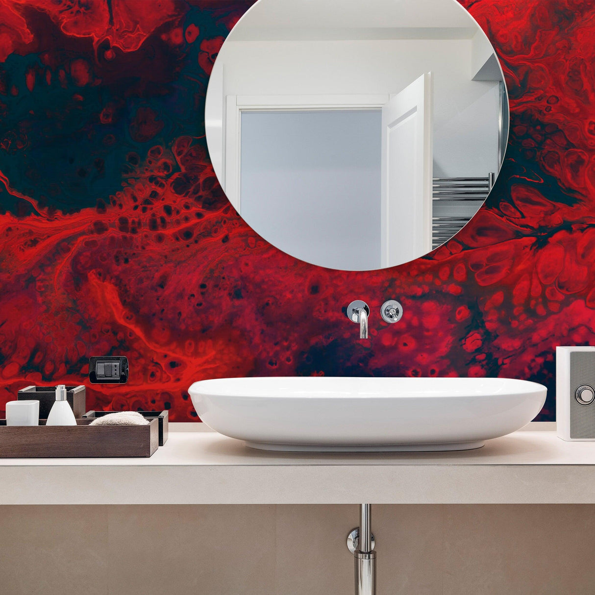 Modern bathroom with a round mirror and red marble vinyl wallpaper, featuring a sleek white sink and wooden decor.
