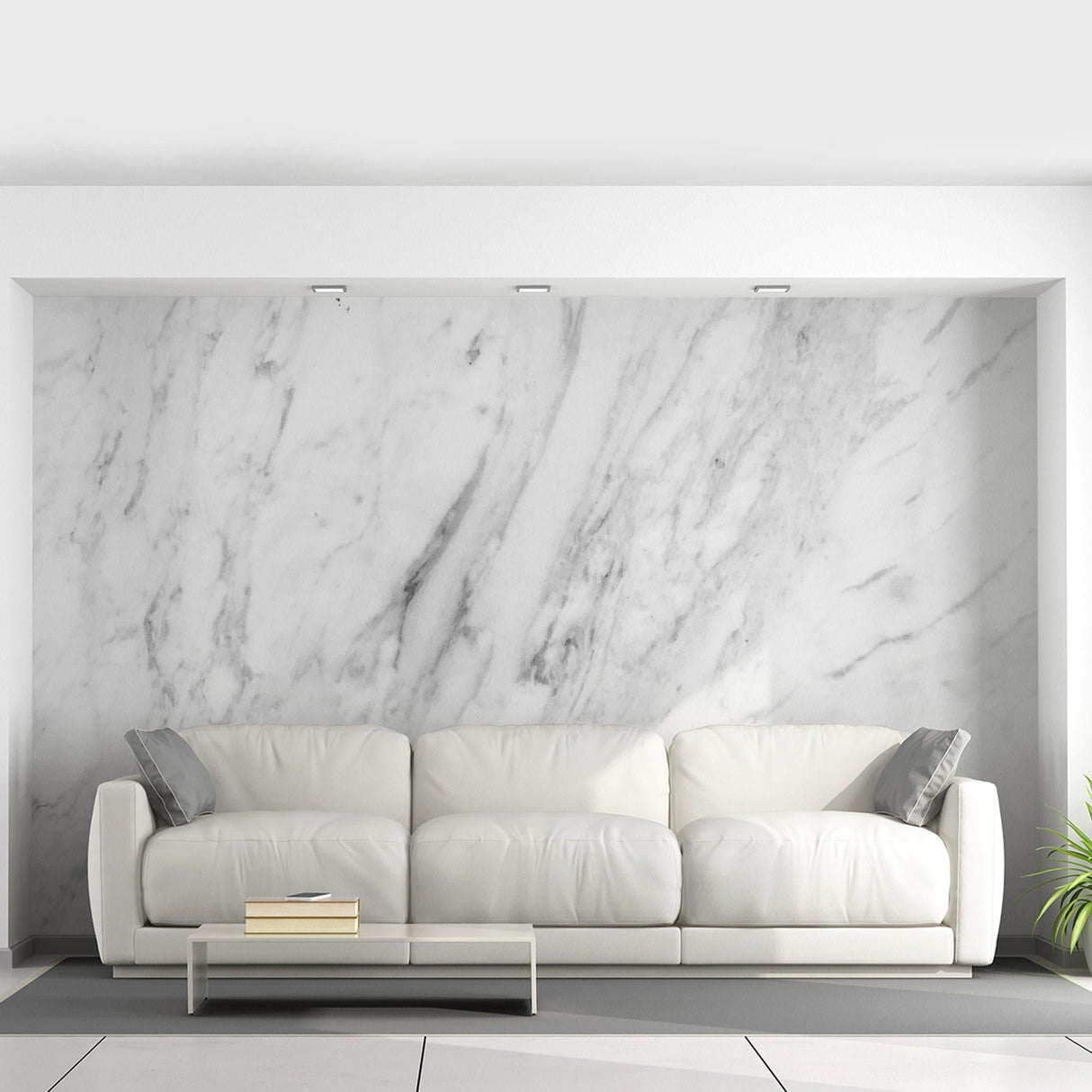 Elegant marble vinyl wallpaper in a modern living room with a white sofa and glass coffee table.