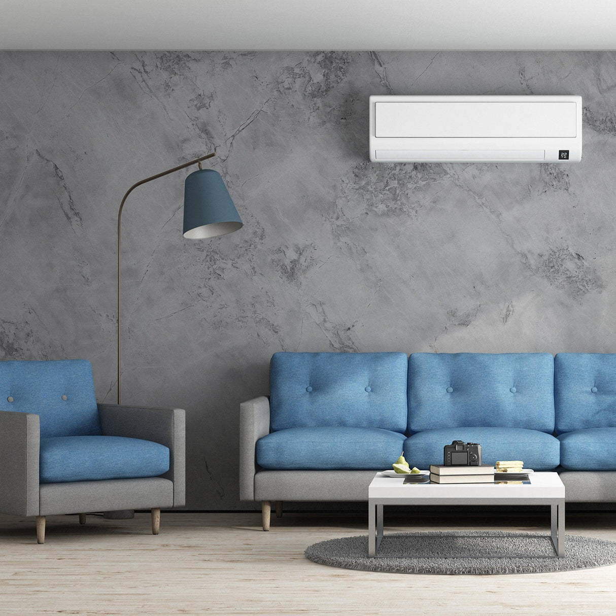 Modern living room with blue sofas and a marble wallpaper design, showcasing elegance and sophistication in home decor.