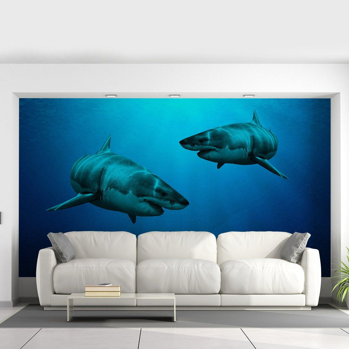 Wallpaper Shark Decor Sticker featuring two 3D sharks swimming in an underwater scene above a modern white sofa.