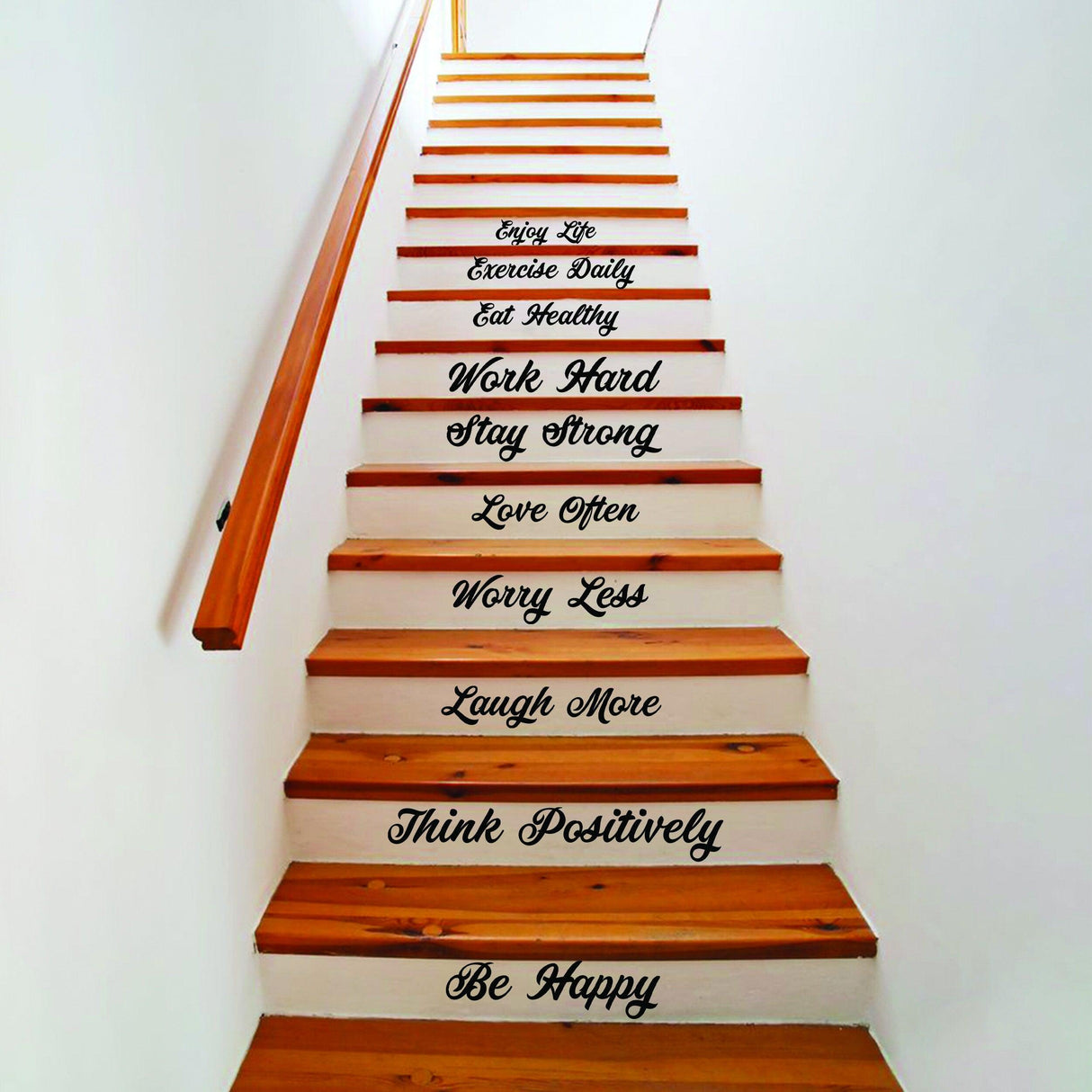 Vinyl decals with motivational quotes on wooden staircase, adding charm to home decor.