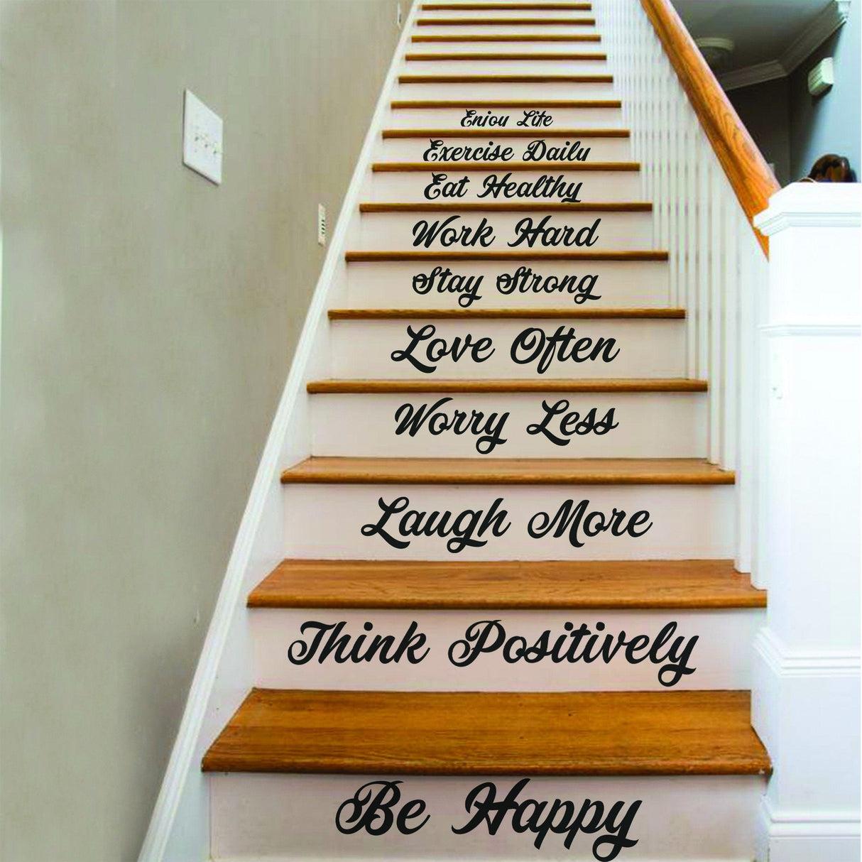 Decorative vinyl decals with motivational quotes on staircase risers, enhancing home decor.