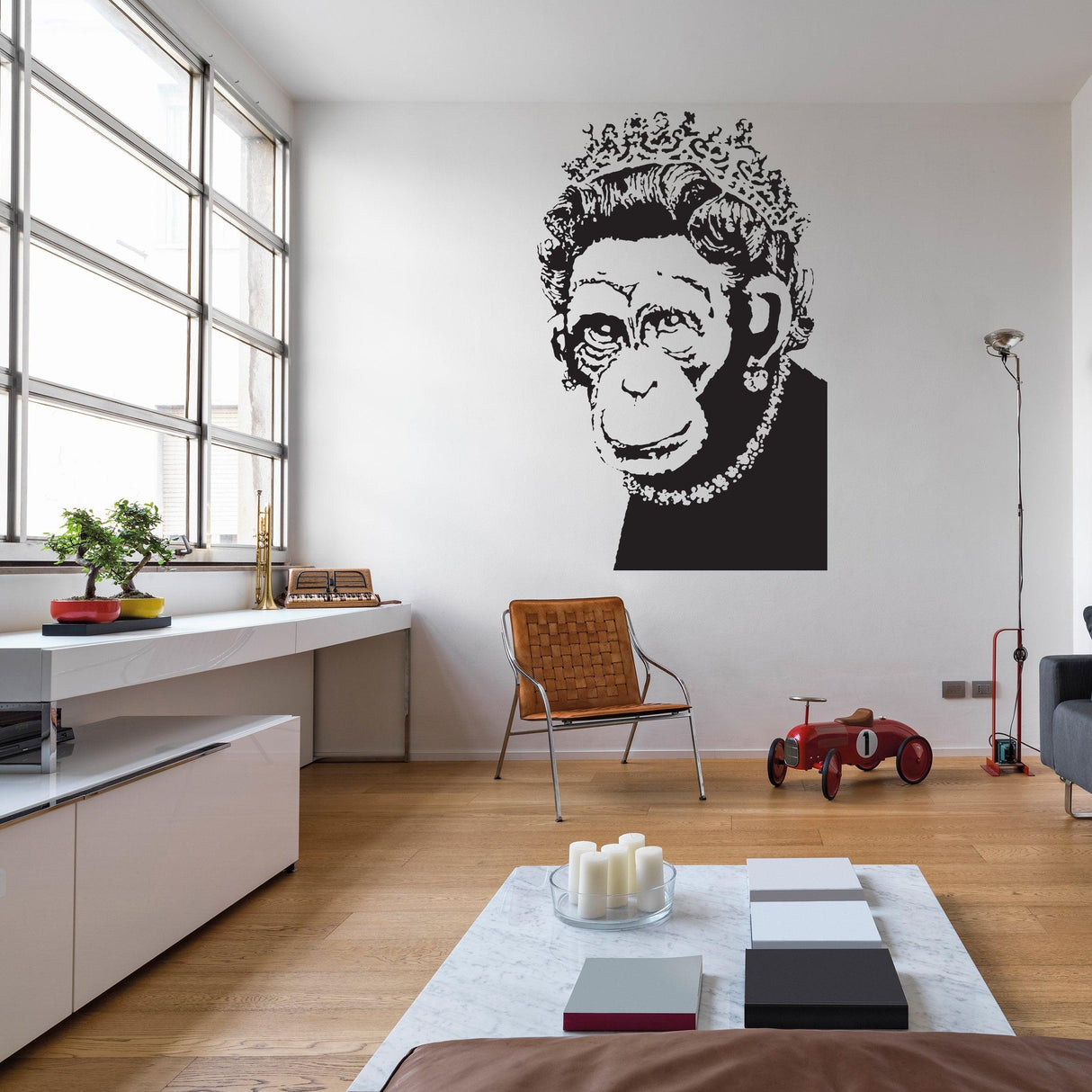 Banksy-inspired monkey queen wall art sticker in modern kitchen, adding humor and positivity to decor.