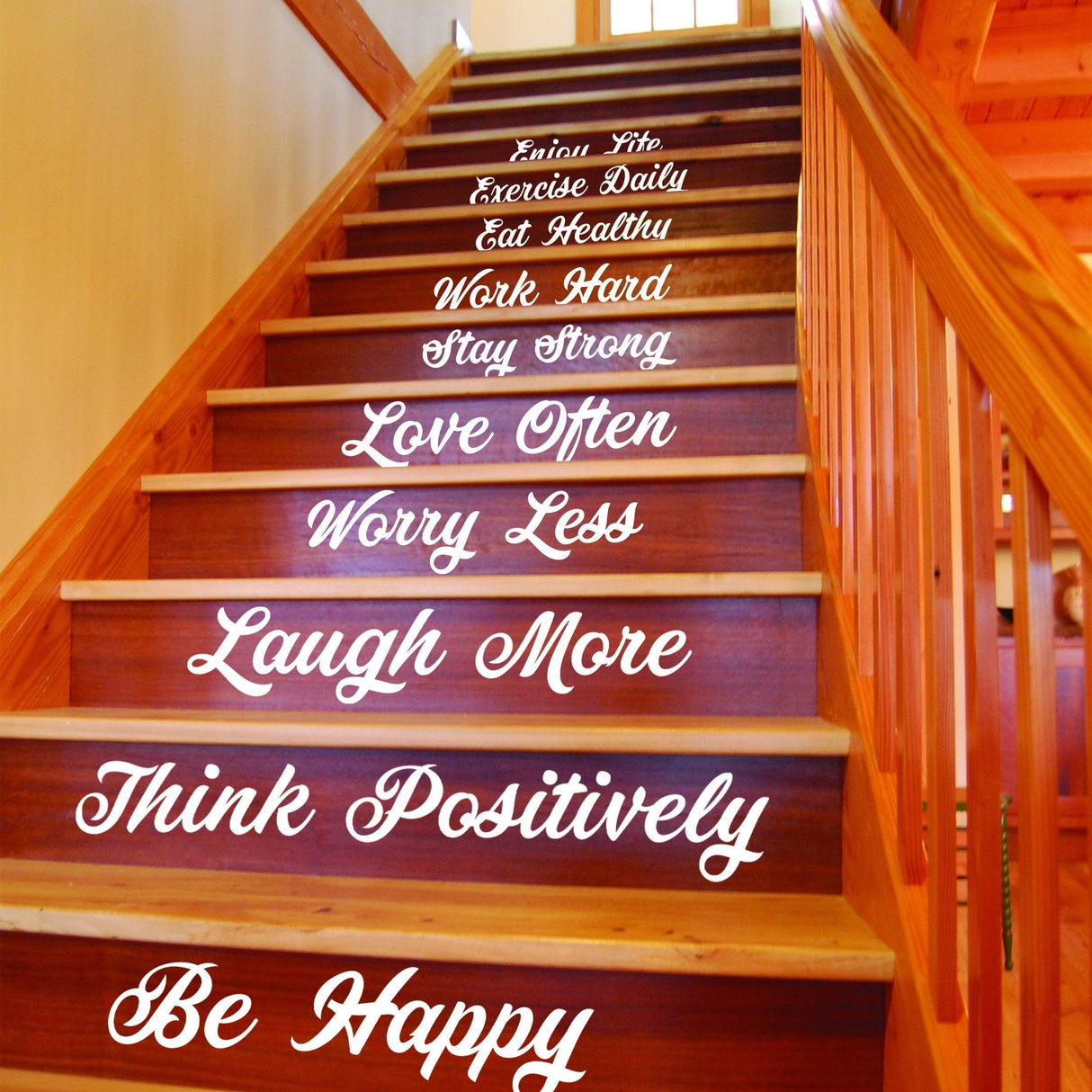 Stair riser vinyl decals featuring motivational quotes like 'Love Often' and 'Be Happy' for home decor.