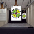 Large outdoor shooting targets set in a practice range, featuring colorful circle designs for accurate aiming.