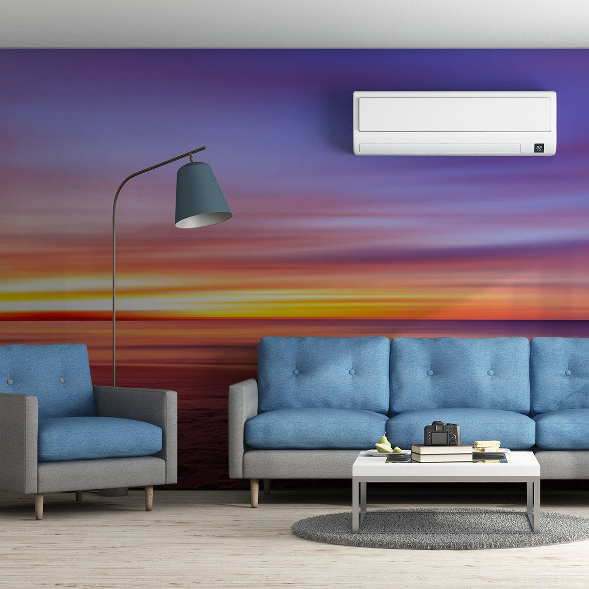 Elegant living room featuring sunset wallpaper decals, blue couches, and modern decor.