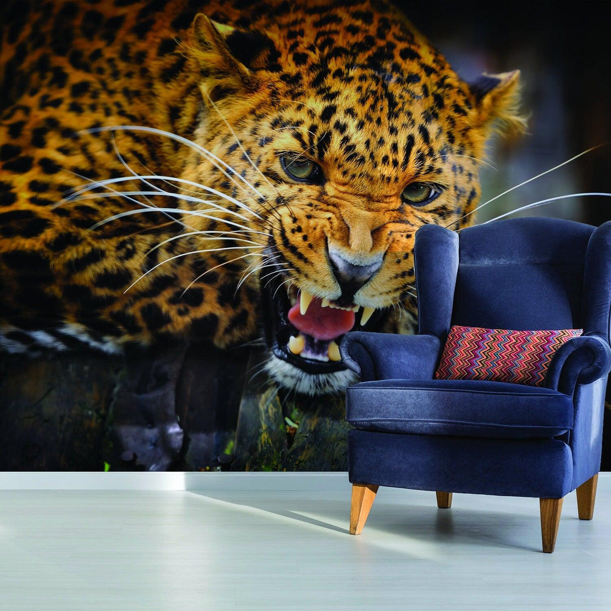 Jaguar wallpaper vinyl decal with a fierce design, showcased in a stylish living room with a blue chair.