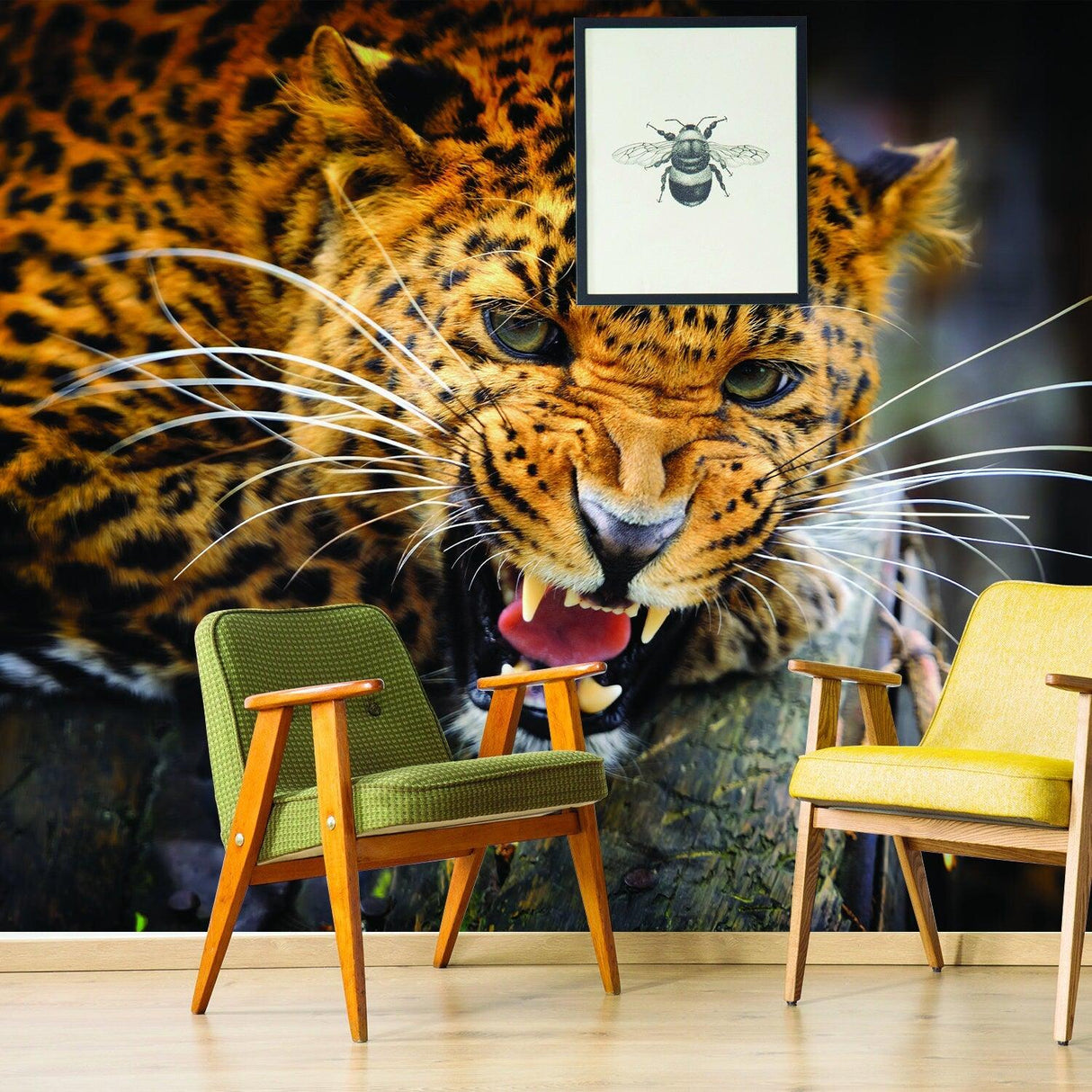 Jaguar wallpaper mural featuring a fierce jaguar face, complementing modern chairs in a stylish living room.
