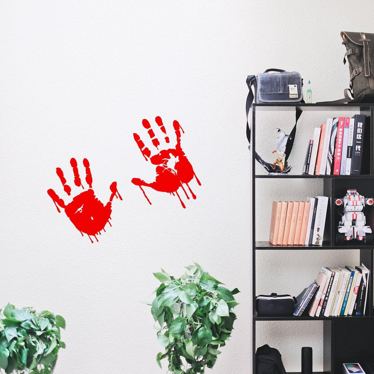Bloody hands red vinyl sticker on wall, perfect for Halloween decor or horror-themed spaces.