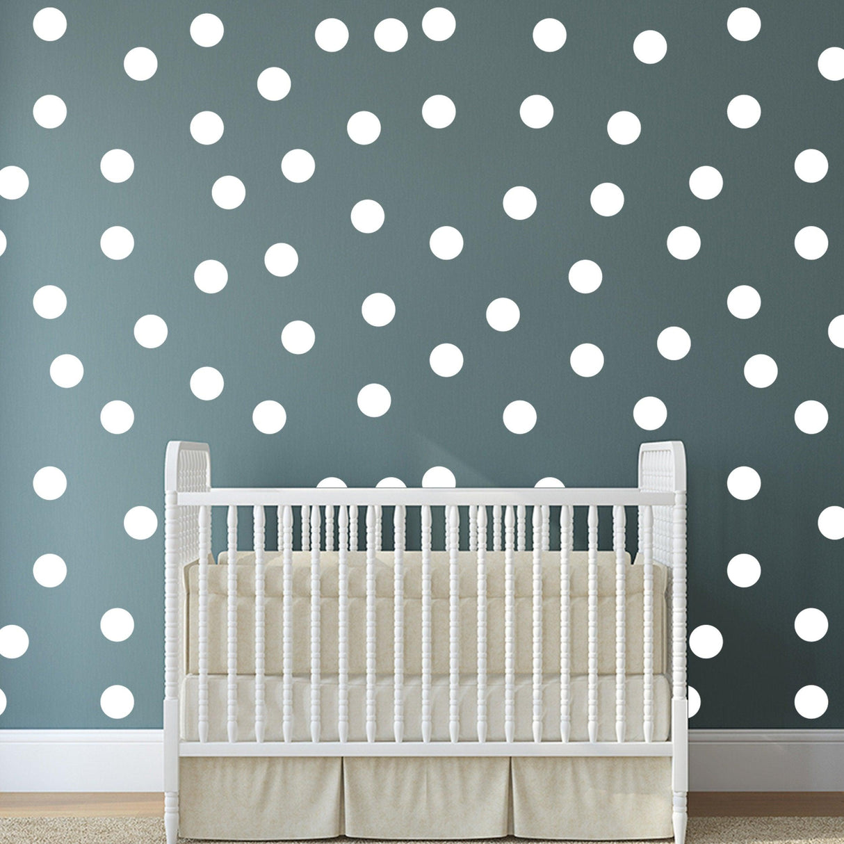 White 2-inch round dot labels on a stylish wall, enhancing a modern nursery decor with a playful touch.