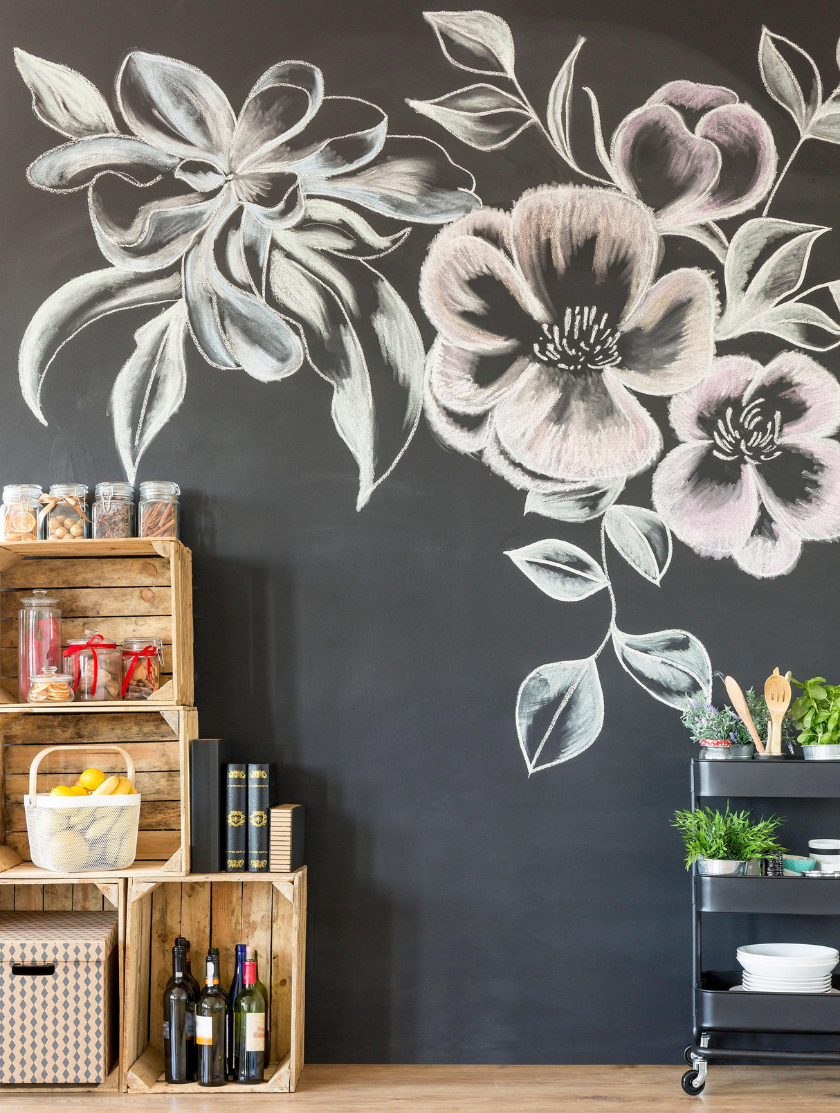 Chalkboard wall with colorful floral drawings, showcasing a stylish kitchen decor and storage setup.