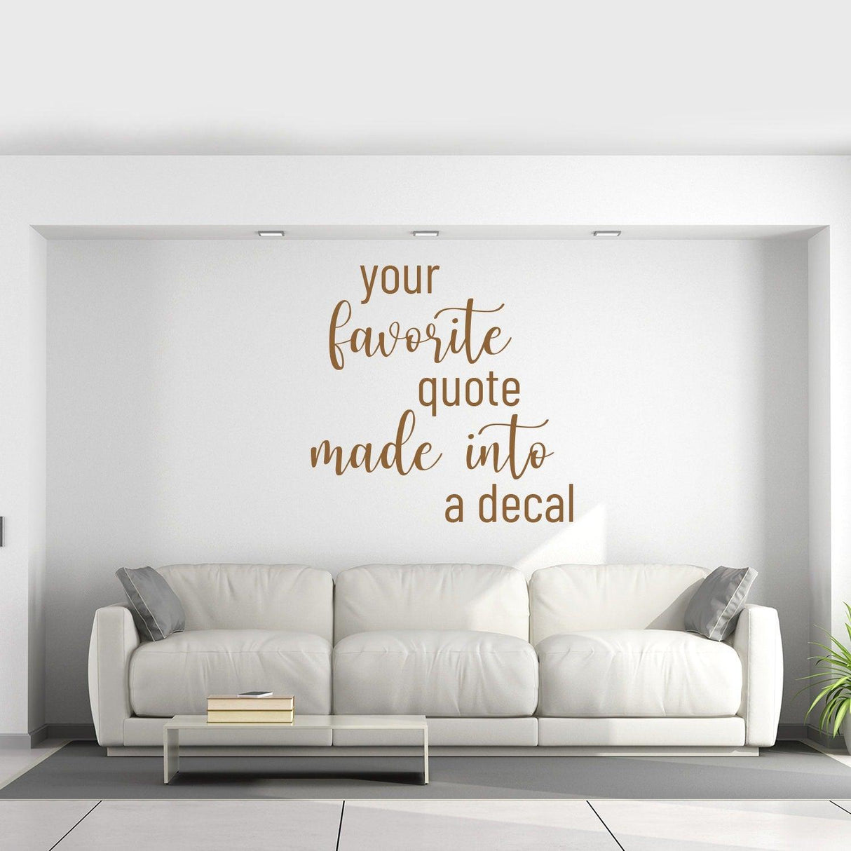 Custom vinyl lettering decal of a favorite quote above a modern white couch in a stylish living room.