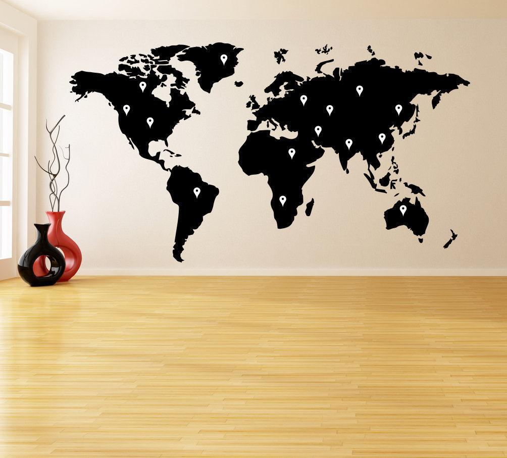 World map wall decal in black vinyl on a stylish living room wall, ideal for travel enthusiasts.