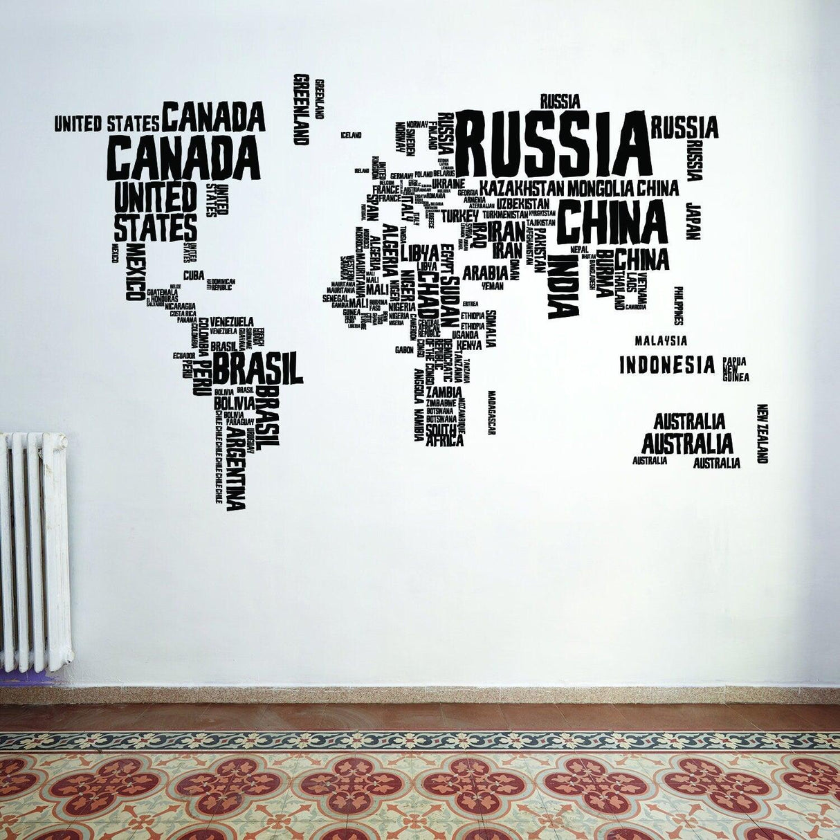 World map wall decal design featuring country names in various sizes on a white wall.
