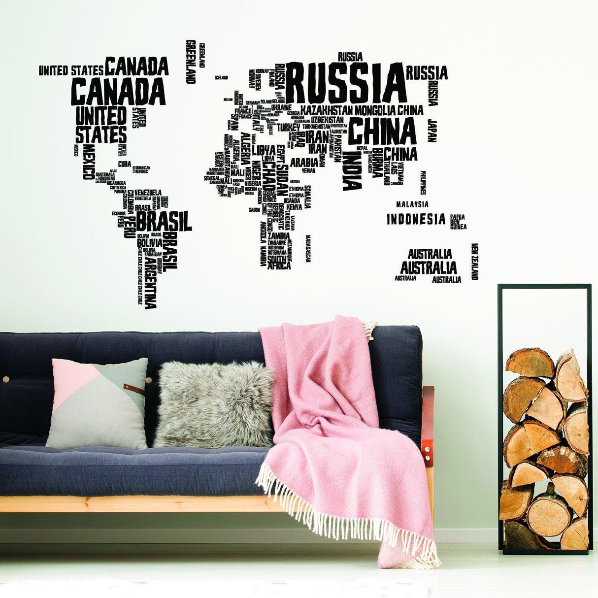 World map wall decal featuring country names in bold text, enhancing living room decor with a modern touch.