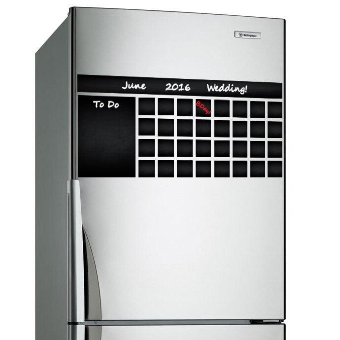 Chalkboard wall planner sticker on refrigerator showcasing a wedding planning calendar for June 2016.
