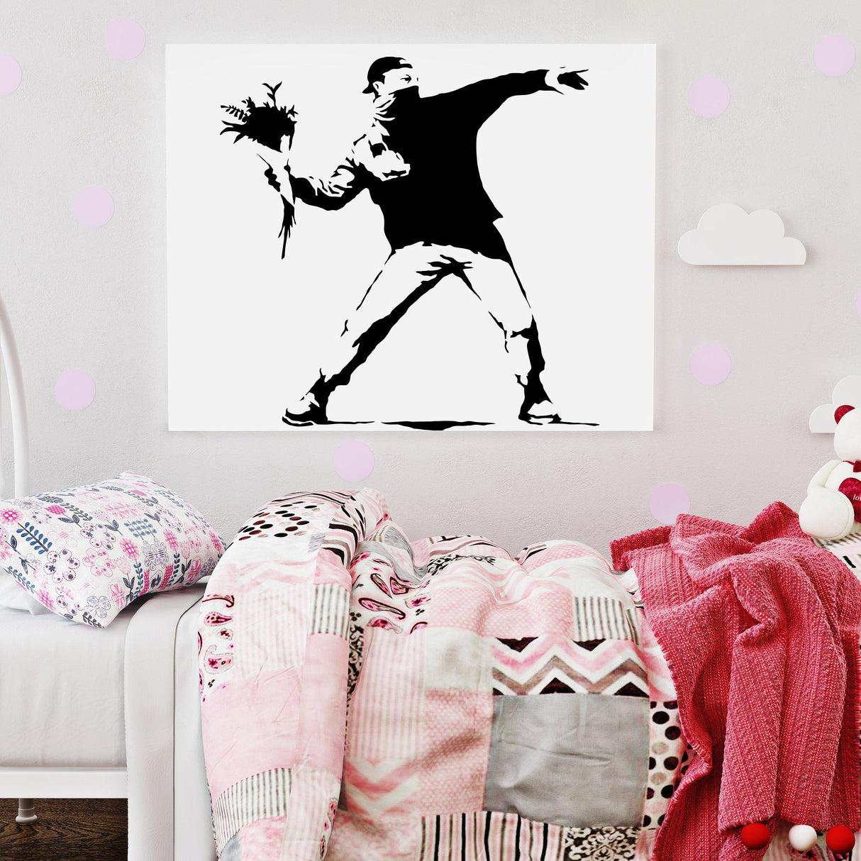 Banksy Flower Thrower wall decal in a stylish bedroom setting with pink decor and cozy bedding.