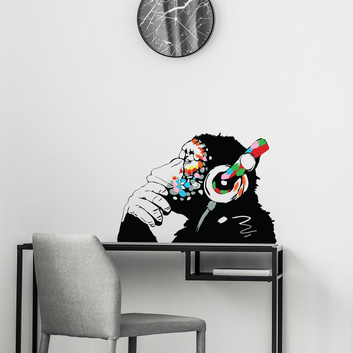 Banksy monkey with headphones wall sticker, vibrant vinyl decal adding creativity to modern decor.