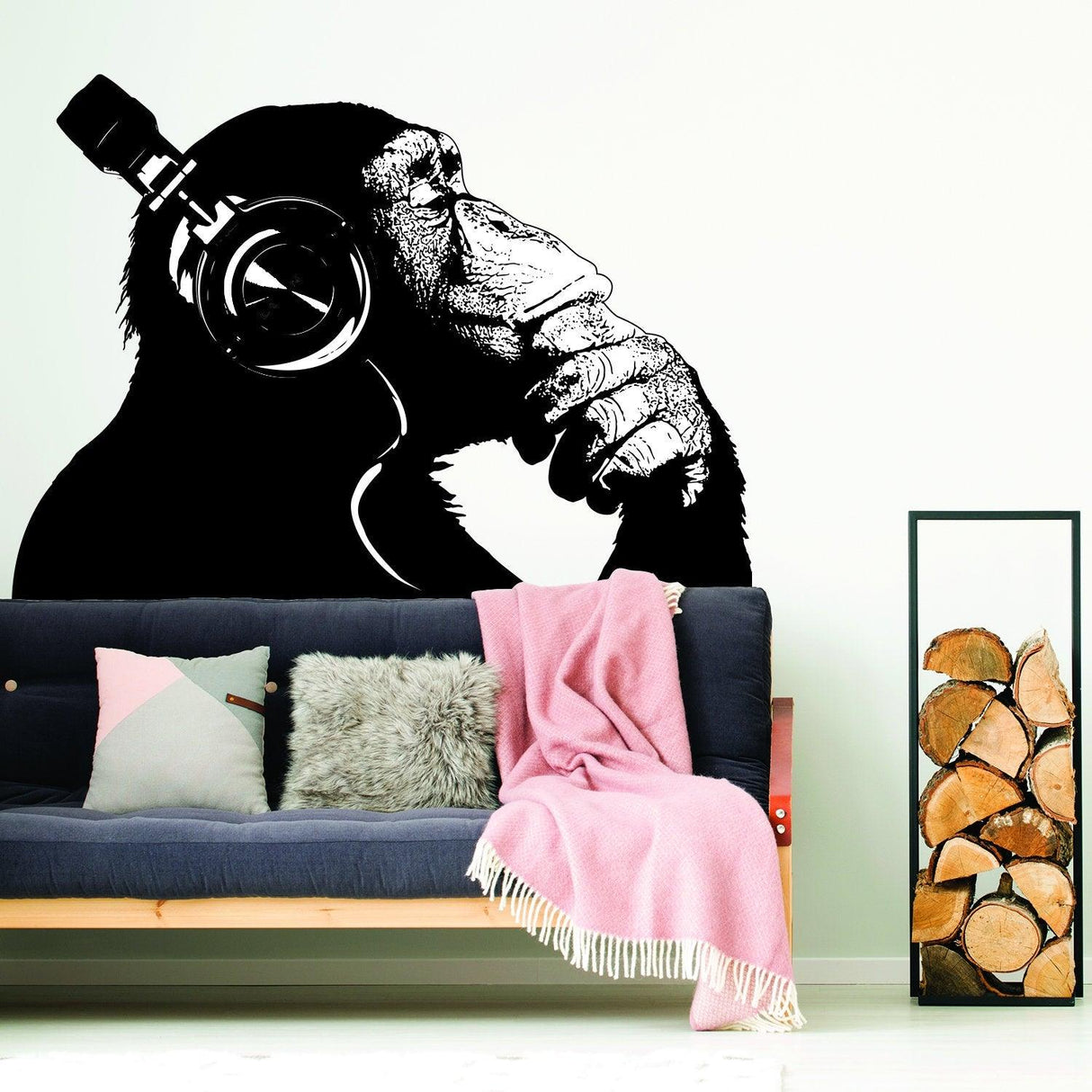 Banksy-inspired monkey with headphones wall sticker, adding creativity and humor to any room decor.