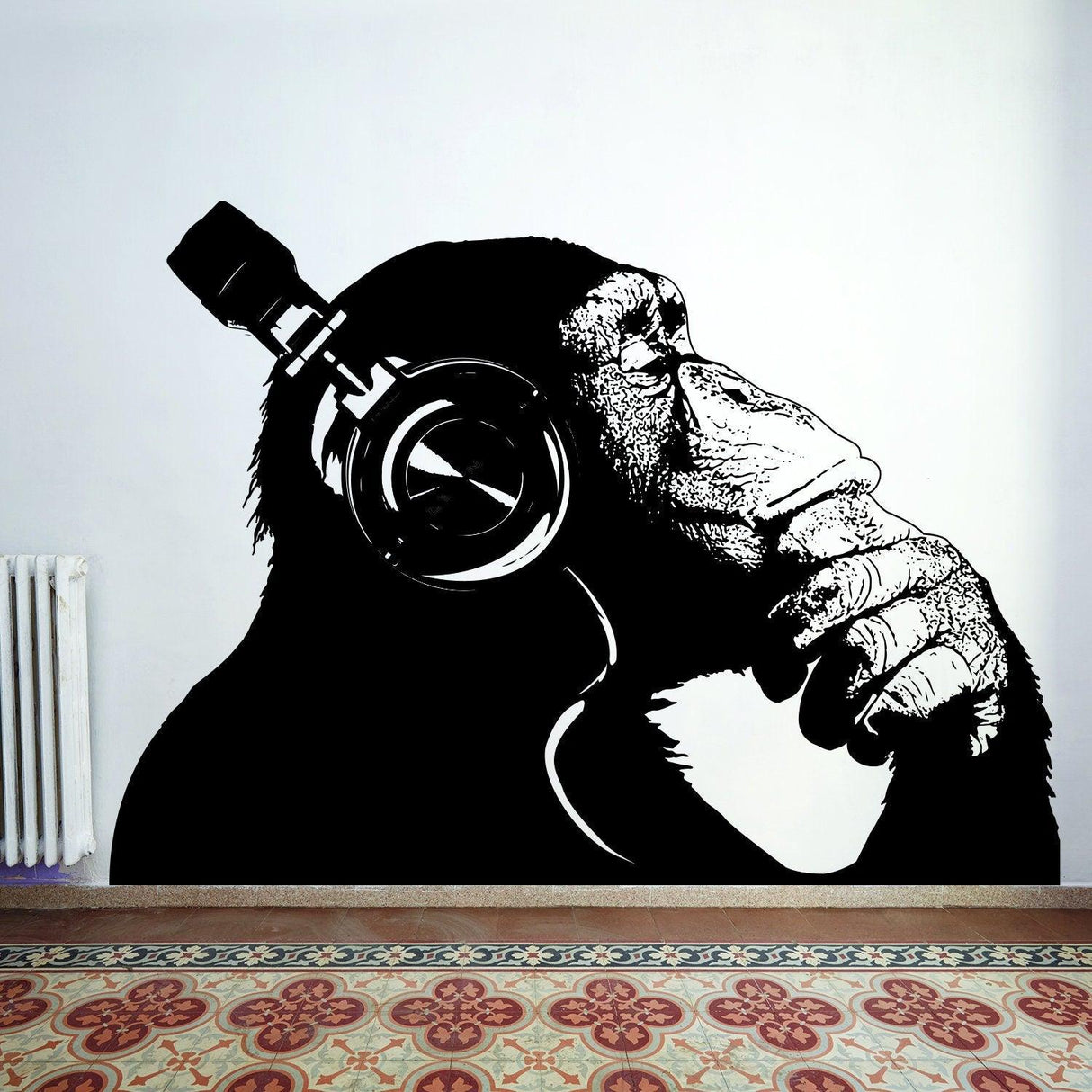 Stylish monkey wall decal wearing headphones, adding a fun and artistic touch to any space.