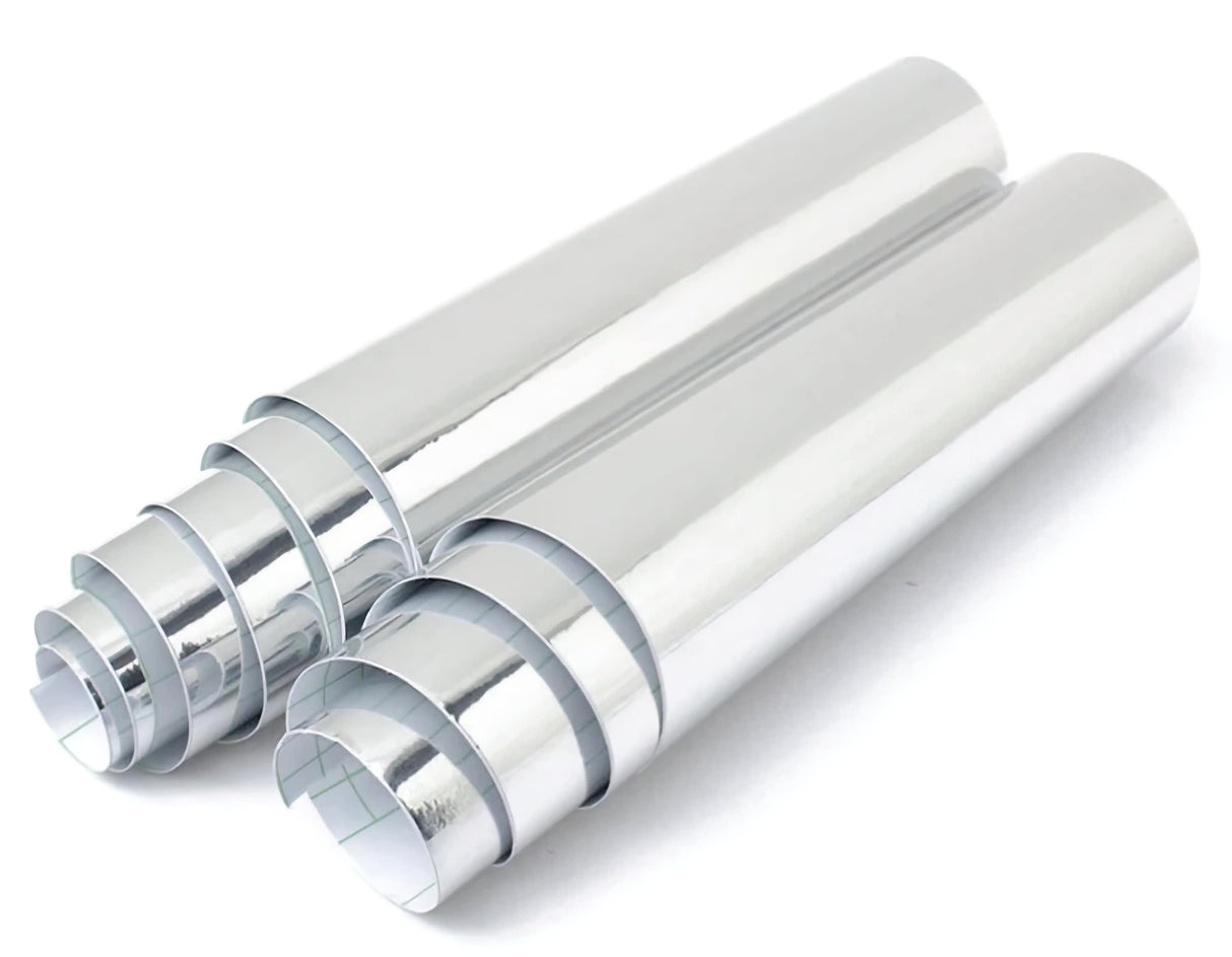 Two rolls of Silver Chrome Interior Vinyl Sticker Wrap showcasing a sleek metallic finish for automotive interior upgrades.