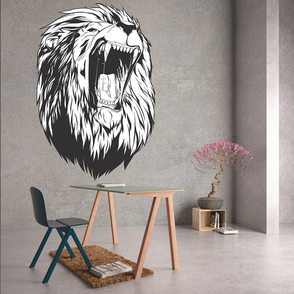Lion head wall decal in a modern room with a chair and decorative plant, perfect for stylish decor.