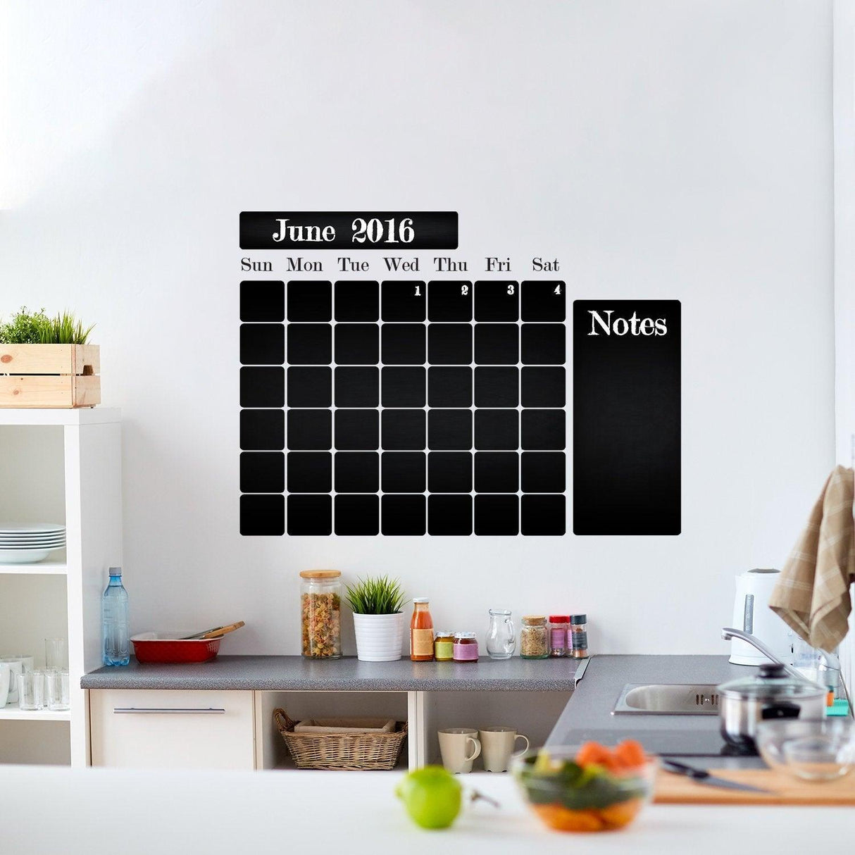 Chalkboard wall planner in a kitchen, featuring a monthly calendar and notes section for organized meal planning.