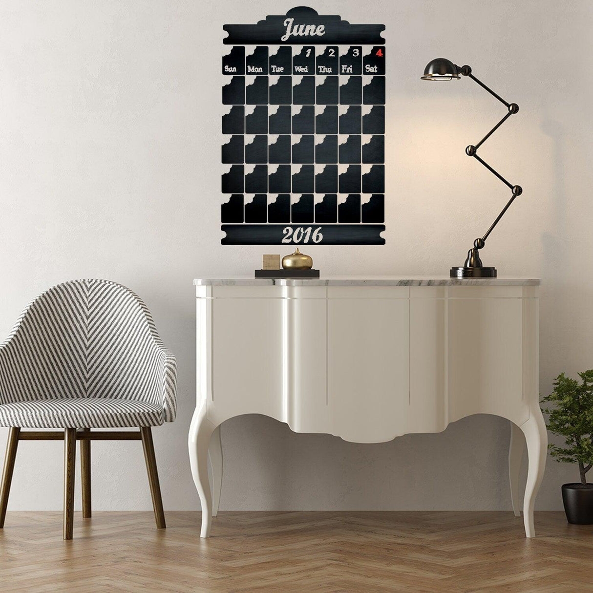 Chalkboard wall planner for June 2016 displayed above a sleek white console table with modern lamp.