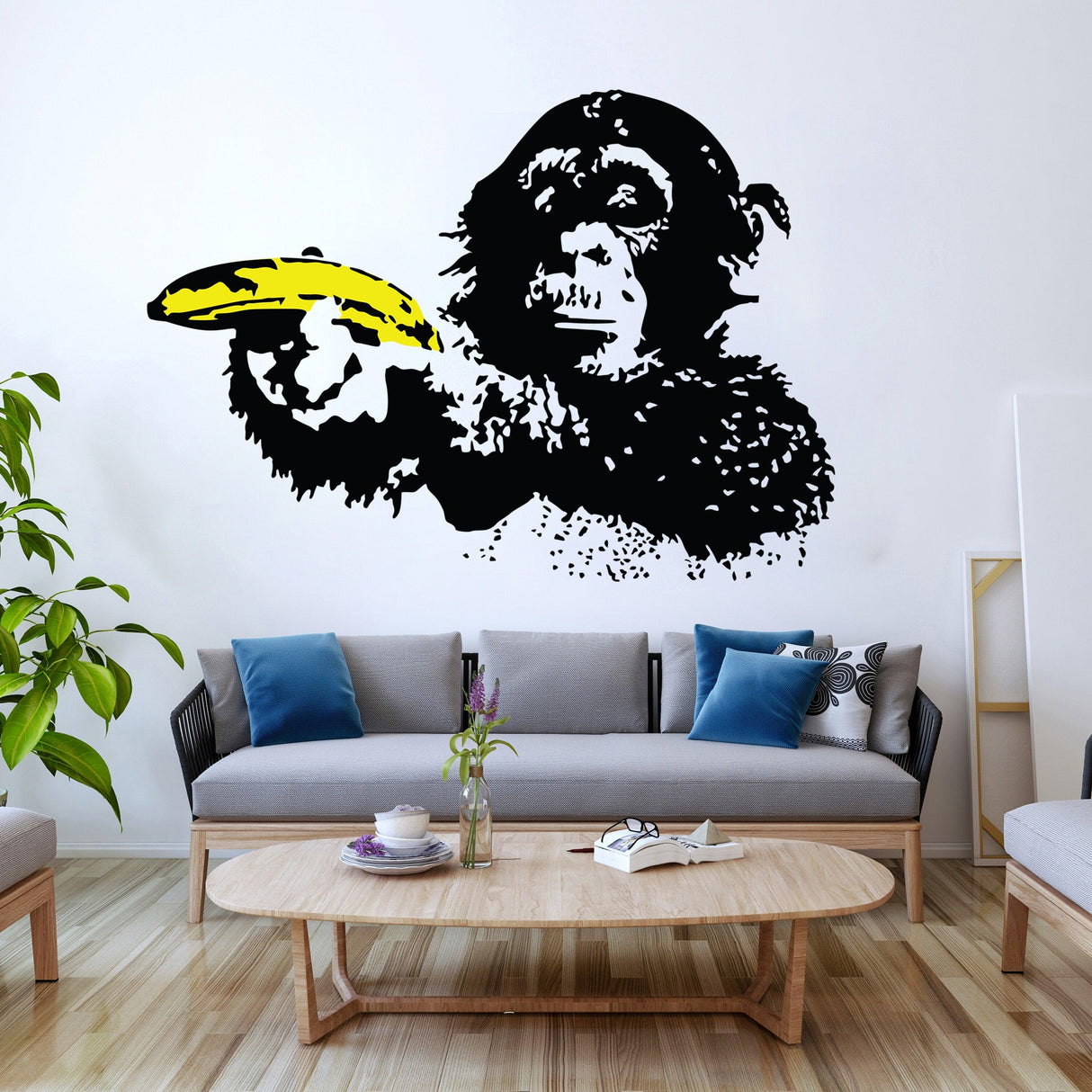 Banksy monkey wall sticker decal with banana, urban art style in modern living room decor.