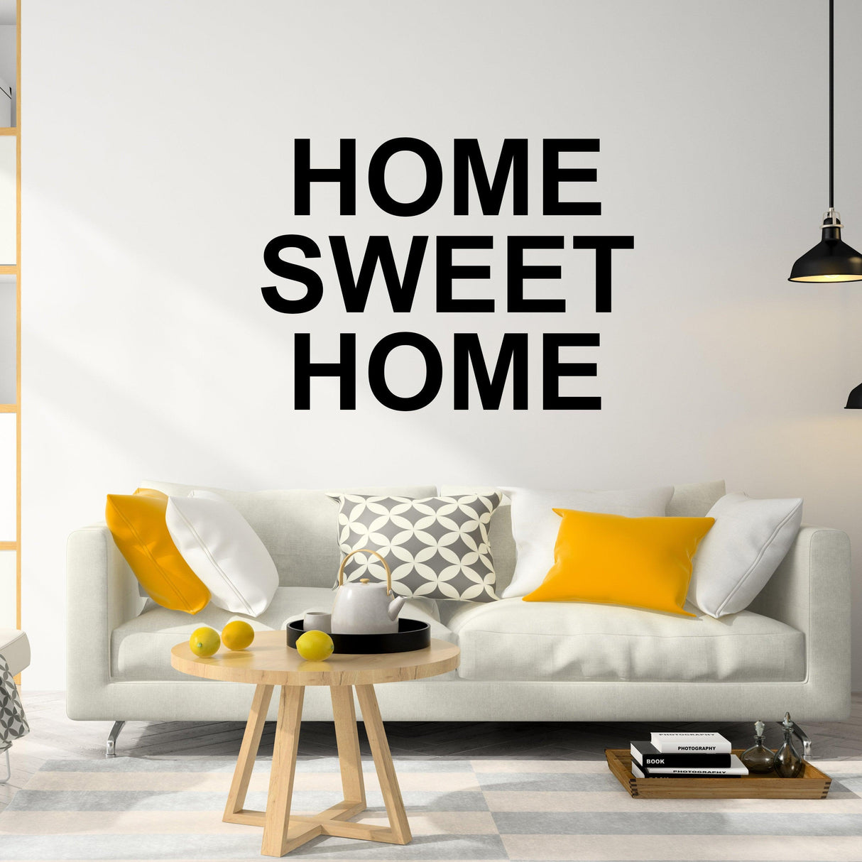Home Sweet Home wall decal above a cozy sofa in a modern living room setting.