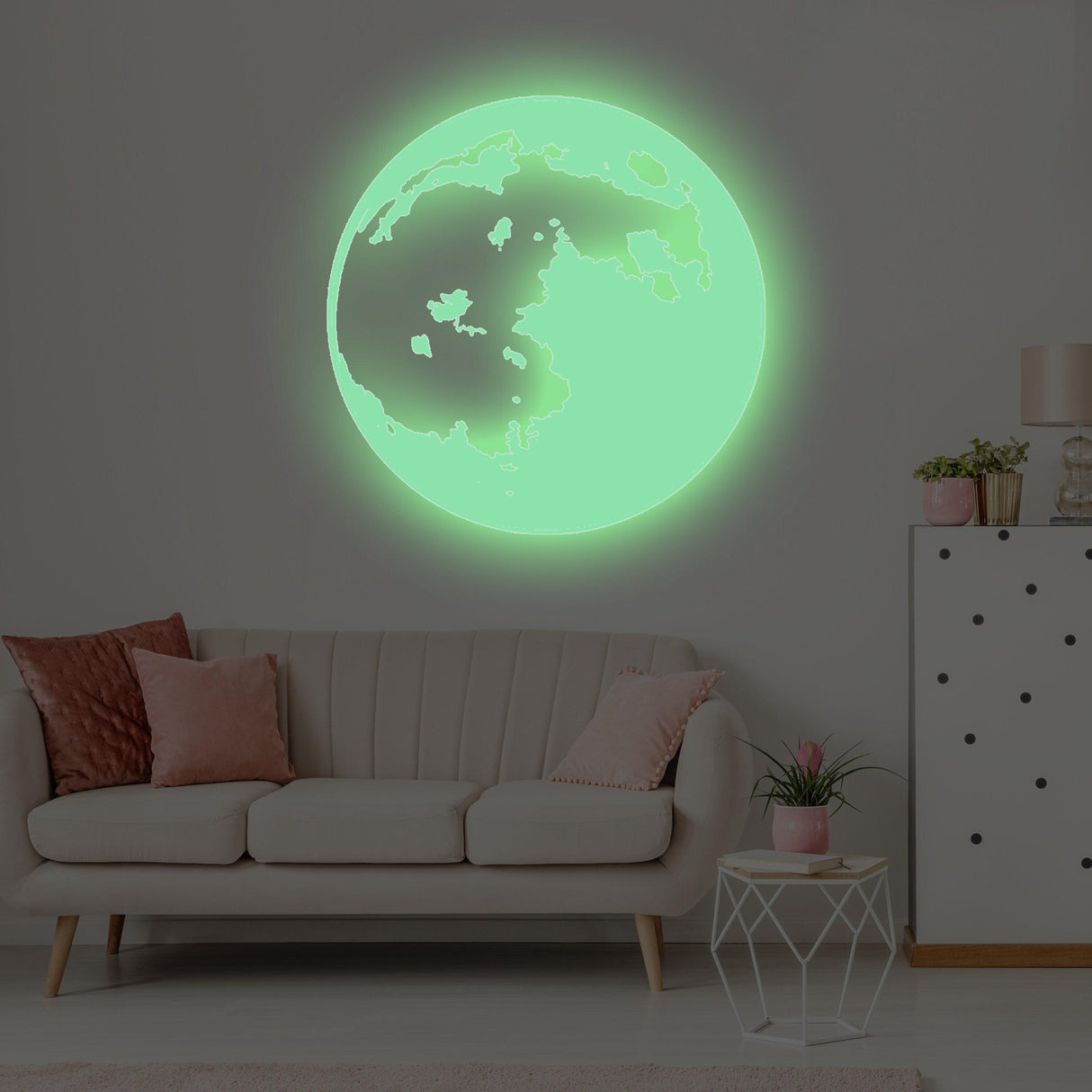 Glow in the dark moon wall sticker illuminating a kid's room, adding a magical touch to bedroom decor.